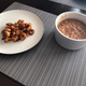 Side of refried beans mixed with chiles and queso fresco.